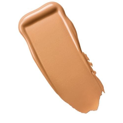 En prøve af beige flydende makeup med en glat, buet form og nogle teksturerede kanter.