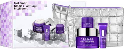 A Clinique skincare set with purple jars, a silver bag, and boxes, emphasizing anti-aging skin care.