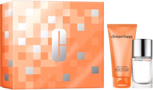 A beauty set with a calendar, body cream and perfume in orange and silver packaging.