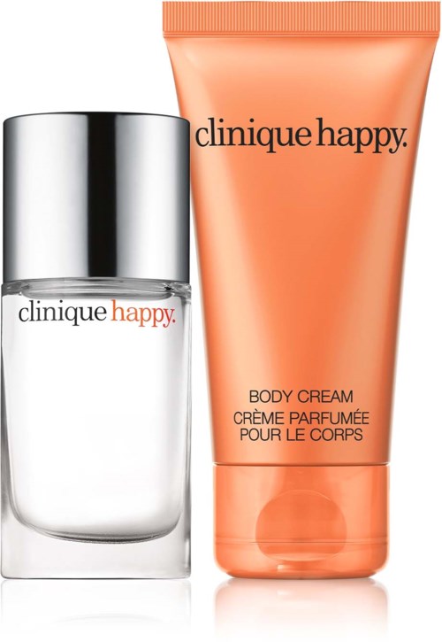Two Clinique Happy products: a small perfume bottle and a peach-colored body cream tube.