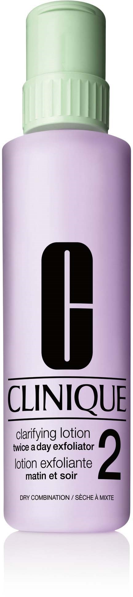 En Clinique-flaske med lilla kropp, grønt lokk og svart tekst, merket som Clarifying Lotion 2 for tørr hud.