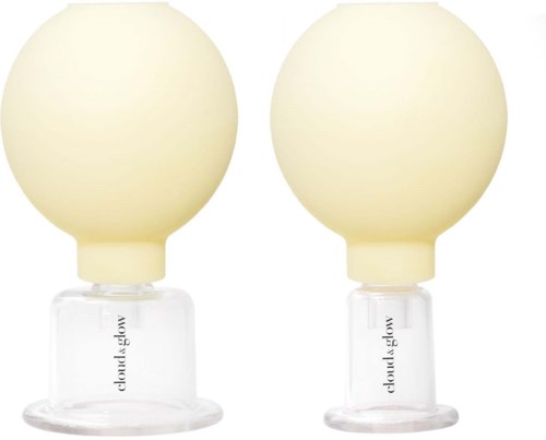 Two white spherical objects on clear bases, with the words 'cloud glow' printed on them.