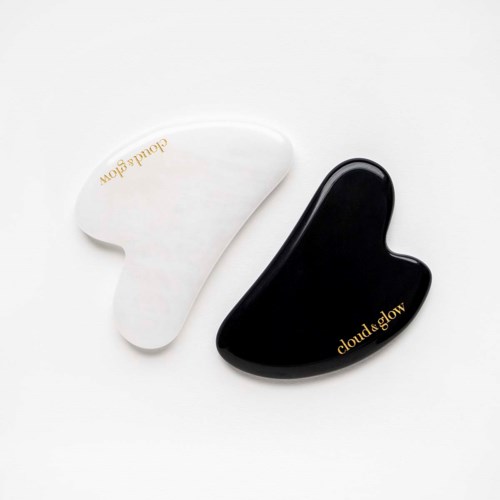 Two teardrop-shaped objects, one white and one black, with gold text reading "cloud&glow."