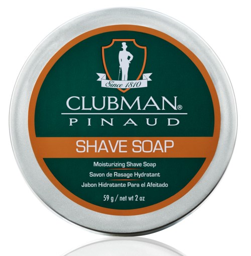 En rund boks av Clubman Pinaud Barberkrem med merking og tekst på flere språk.