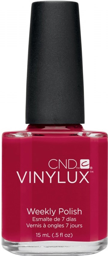 En flaska rosa nagellack med svart lock och vit text på framsidan.