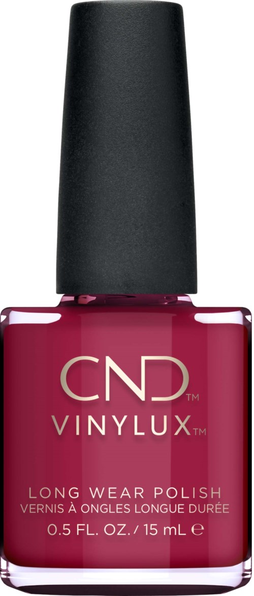 En flaska med rosa nagellack med svart lock, märkt CND VINYLUX Long Wear Polish.