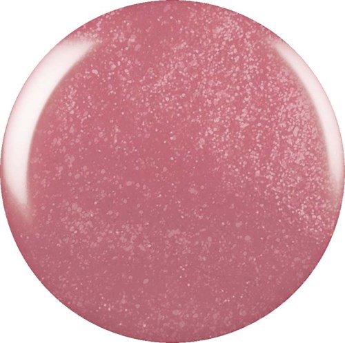 Ronde roze voorwerp met kleine witte vlekjes, lijkt op een zachte, getextureerde oppervlakte of capsule.