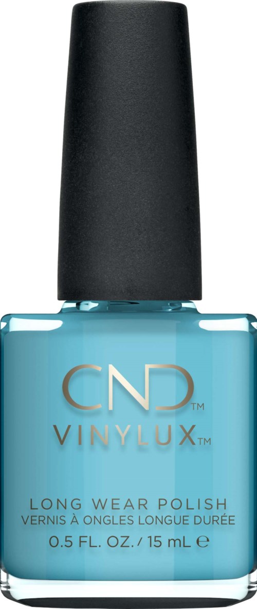 En flaska med blå nagellack med svart lock och guldtext som säger CND VINYLUX.