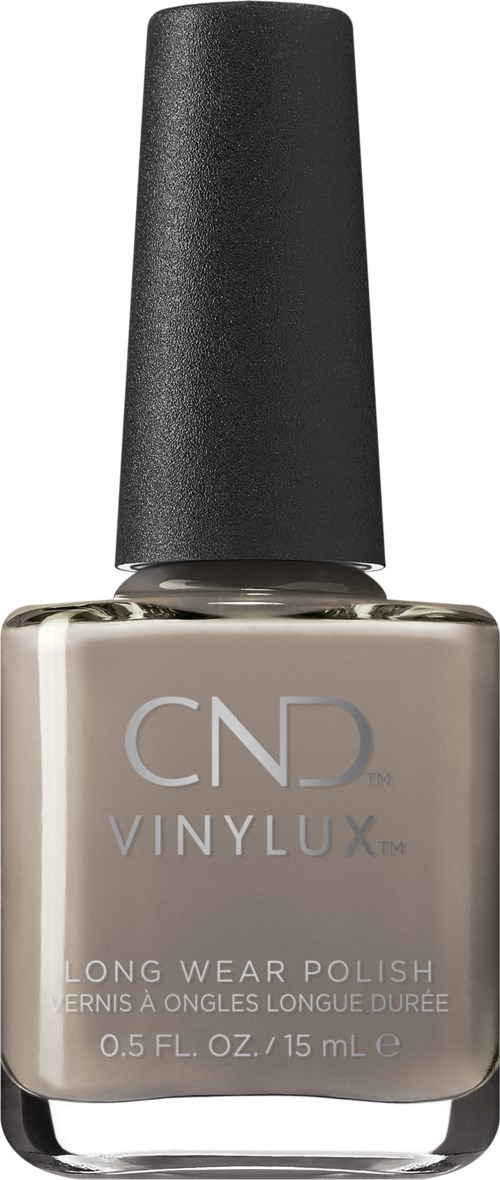 En flaska nagellack i beige med svart lock, märkt CND VINYLUX, långvarig formel, 0,5 fl oz.
