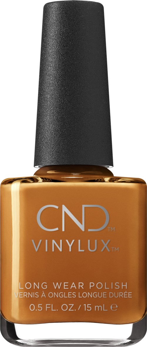 En CND VINYLUX nagellackflaska i karamellfärg med svart lock.