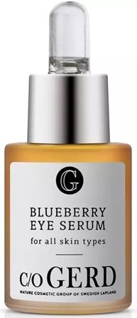 En gulaktig flaske med sølvhette, merket 'Blueberry Eye Serum' fra C/O RED, designet for alle hudtyper.