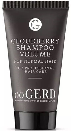 En svart tub märkt 'Cloudberry Shampoo Volume' för normalt hår, med eco och professionella hårvårdsuppgifter.