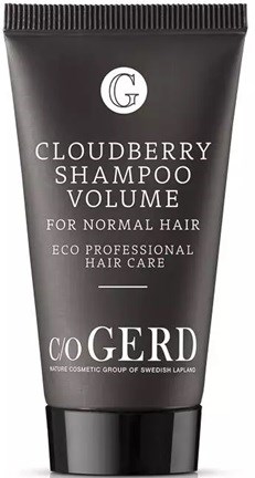 En svart tube med Cloudberry Shampoo Volume for normalt hår, med hvit tekst og en enkel logo øverst.