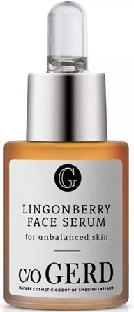 En liten flaske med Lingonberry ansiktsserum med pipette, merket for ujevn hudpleie.
