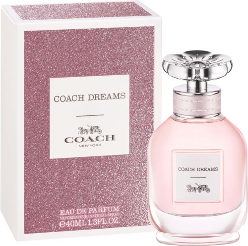 Różowa butelka perfum z srebrnym korkiem i pasującym różowym pudełkiem oznaczonym Coach Dreams.