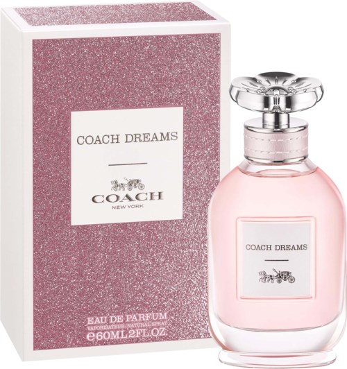 Różowa butelka perfum i pasujące różowe pudełko z napisem "Coach Dreams".