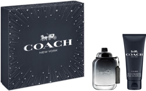 Ett presentset med Coach New York herrparfym med en flaska och en tub. Förpackningen är mörk med stjärnstreck.