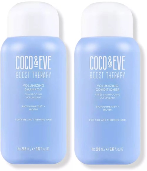 Twee blauwe flessen van Coco & Eve Boost Therapy volumineuze shampoo en conditioner met witte doppen.