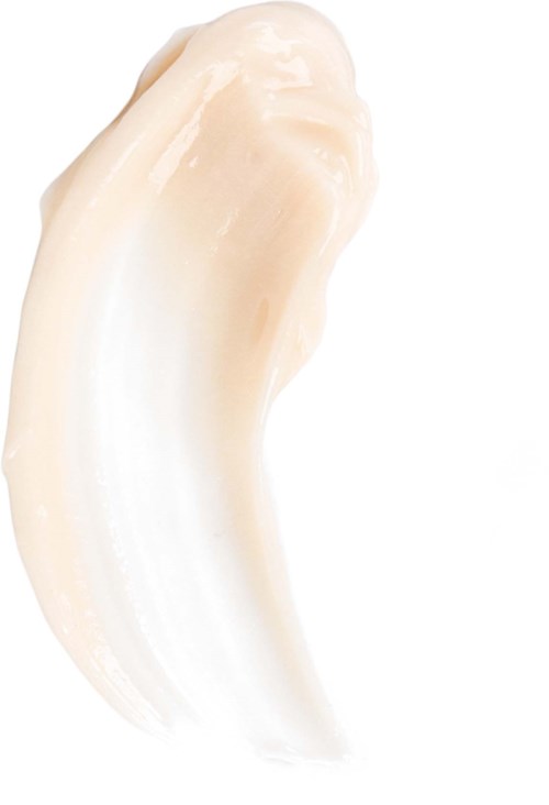 En krem eller lotion med glatt, buet tekstur på hvit bakgrunn.