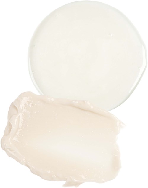Eine runde weiße Schachtel mit weißer Creme oder Lotion und einem Klecks Creme daneben.