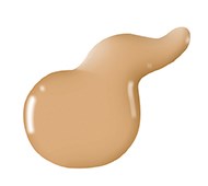 En beige vätskeformig smak med glansig yta, oregelbunden form, verkar vara en hudvårdsprodukt eller makeup.
