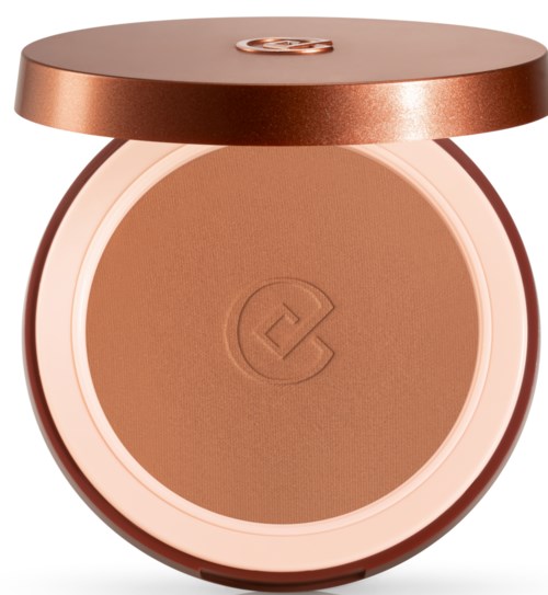 En rund makeup-kompakt med bronsefarget lokk og pudder inni med logo. Enkel og elegant design.
