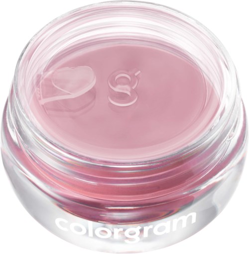 Een kleine ronde glazen container met roze gel of crème erin, gelabeld colorgam.