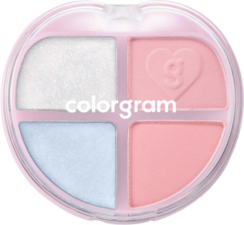 En rund makeup-palett med fyra sektioner, rosa, vit, ljusblå och rosa rouge med ett björnmönster.