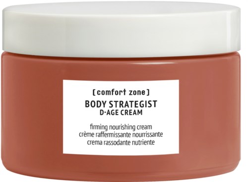 Etglass med Body Strategist D-Age krem fra Comfort Zone, med hvit lokk og ferskenfarget kropp.
