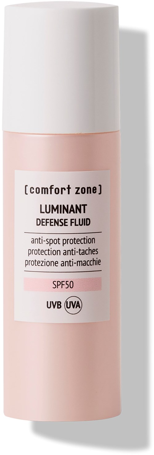 En rosa och vit flaska med etikett för comfort zone LUMINANT Defense Fluid. Innehåller SPF50 och UV-skydd.