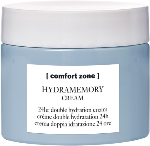 En blå burk med vit lock märkt 'HYDRAMEMORY CREAM' för hudens fukt, med text på flera språk.