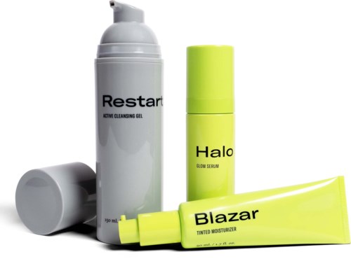 Skincare products including a cleanser gel, serum, moisturizers, and a lotion in yellow and grey containers.