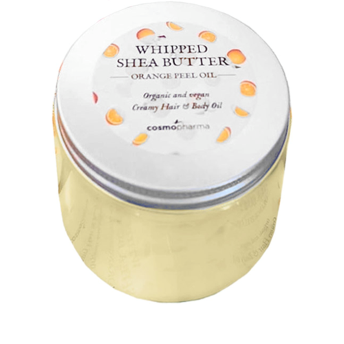 En rund behållare märkt 'Whipped Shea Butter' med vit lock och orange detaljer, innehållande kroppsolja.