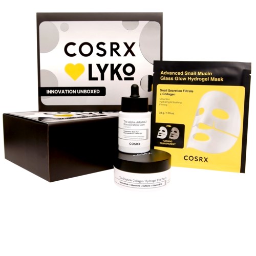 Eine Schachtel mit Hautpflegeprodukten, Maske, Tropfflasche und Cremetopf, alle mit COSRX beschriftet.