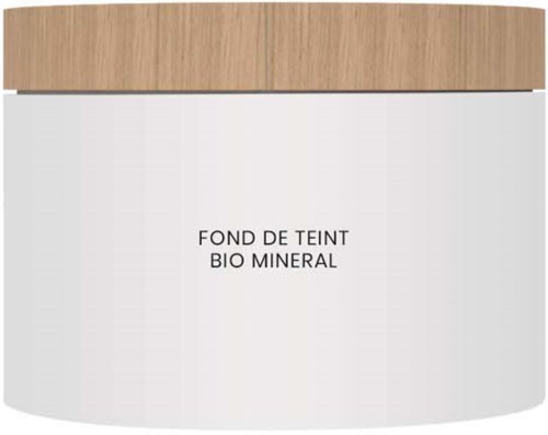 En vit behållare med ett trädörrsskydd, märkt på franska och engelska som en mineral grund.