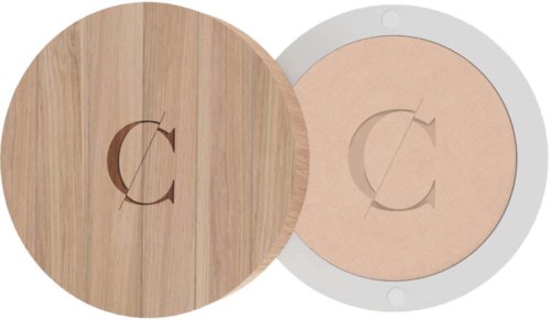 Two round objects with a logo in the center, one wooden and one light-colored. They might be compact cases or coasters.