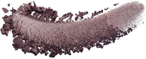 A streak of purple eyeshadow with a powdery texture and scattered remaining powder.
