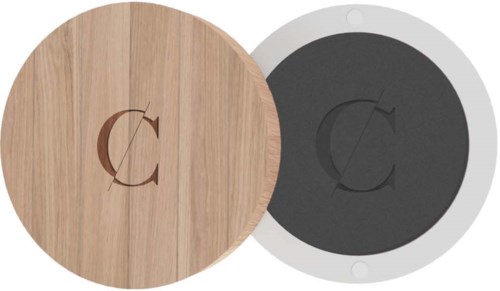 A round wooden and black-colored device with a letter 'C' engraved on each, side by side.