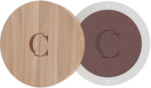 Two round objects, one with wood grain and a letter C, the other with dark color and a letter C.