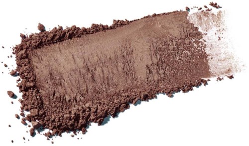 A streak of brown powder, possibly makeup or pigment, spread out on a white surface.