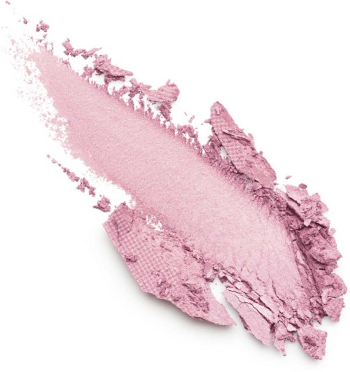 A smear of pink powder, partially crushed, with rough edges and a textured surface.