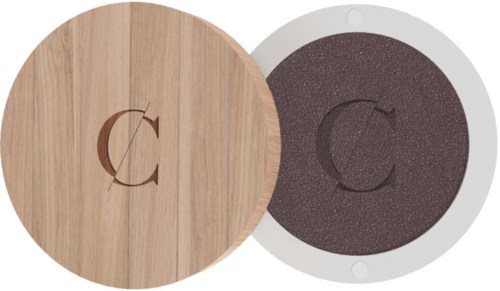 A round wooden lid and a circular sponge cleaning pad with a C logo in the center.
