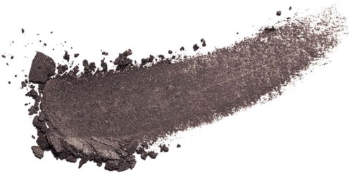Gray powder spread out with some broken pieces, appears to be makeup or pigment. White background.