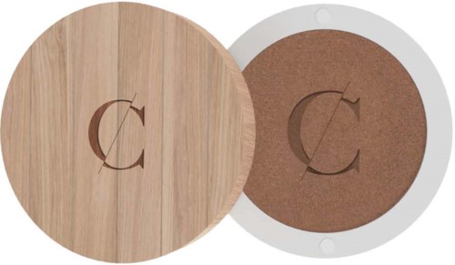 Two circular objects with a 'C' logo, one appears to be wood and the other may be cardboard.