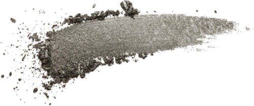 A gray powder spread on a white surface, with some scattered particles around.