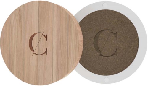 Two round objects, one wooden with a logo, and one gray with a different logo, are placed side by side.