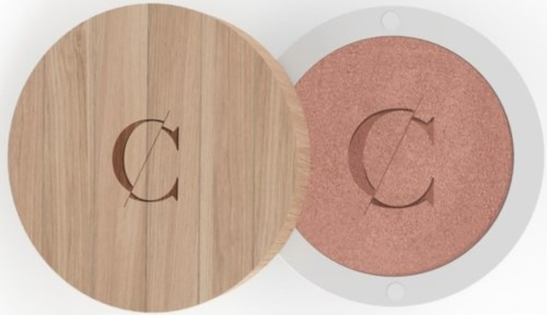 Two circular objects with a 'C' and arrows on them, one has a wooden cover, the other pink inside.