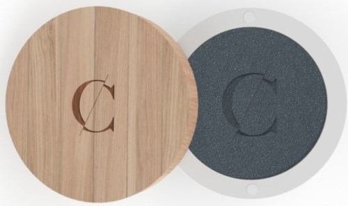 A round wooden object with a letter C in the center, next to a round gray object with the same letter.