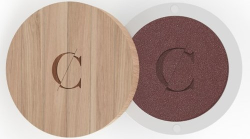 Round wooden and red disk, each with a letter C and an arrow, possibly a logo or design element.
