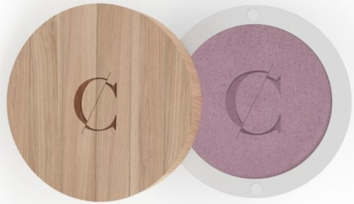 Two round objects, one wood-colored with a hole and letter 'C', the other pink with a similar letter. They are stacked.